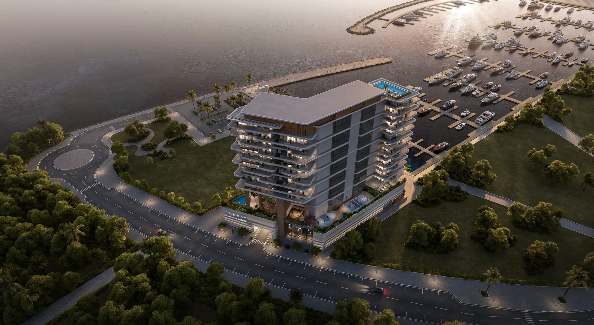 Aerial view at dusk of The Bay Interiors by Missoni beside the Island A yacht marina and park, Dubai Islands