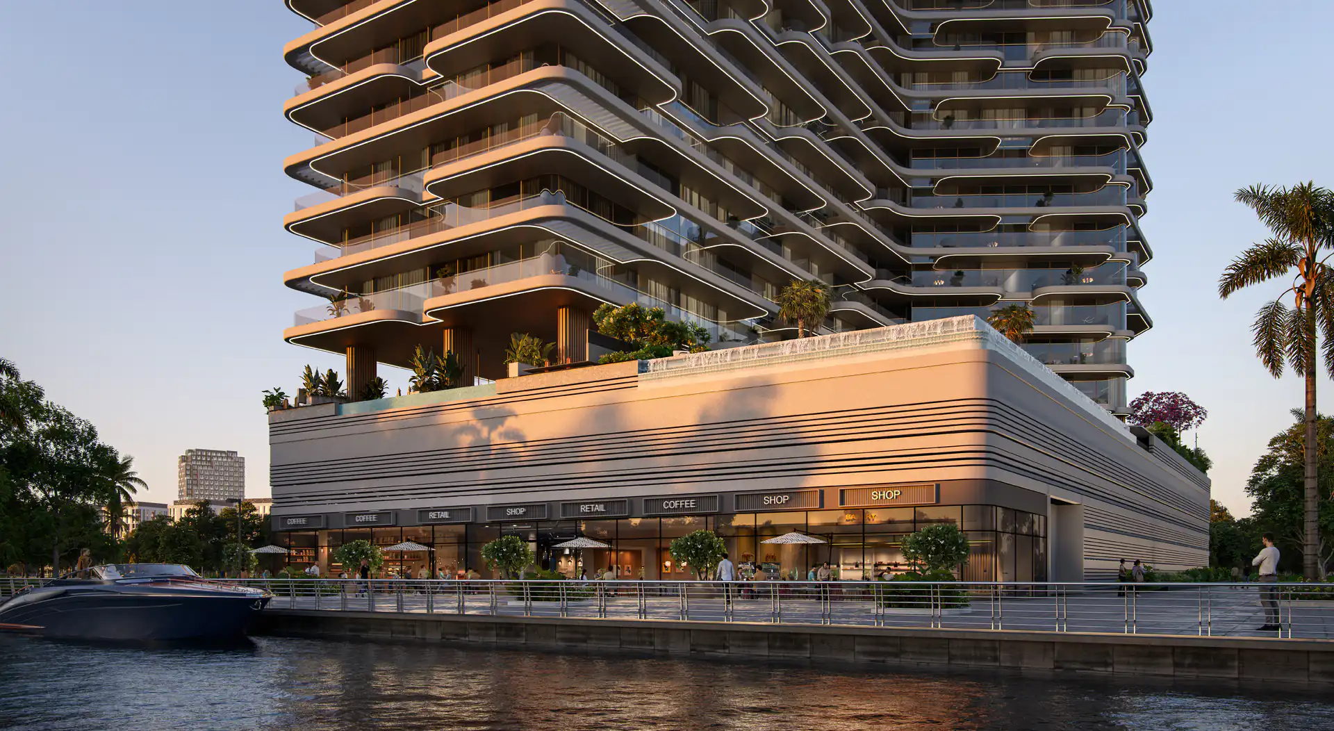 The Bay Dubai Islands podium and retail frontage at dusk on the marina waterfront, with stepped Missoni residences above